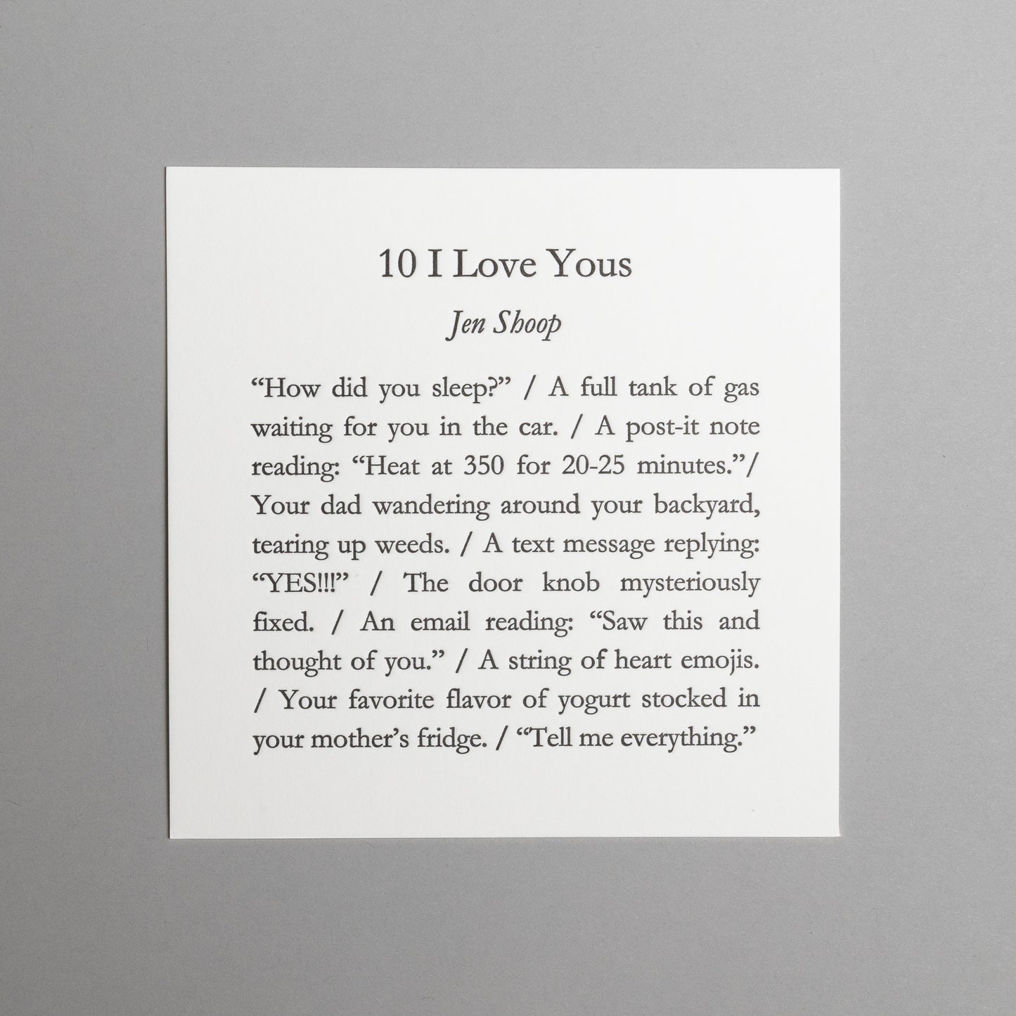 Front view of “10 I Love Yous,” a 5×5 black letterpress print by Jen Shoop on white paper.