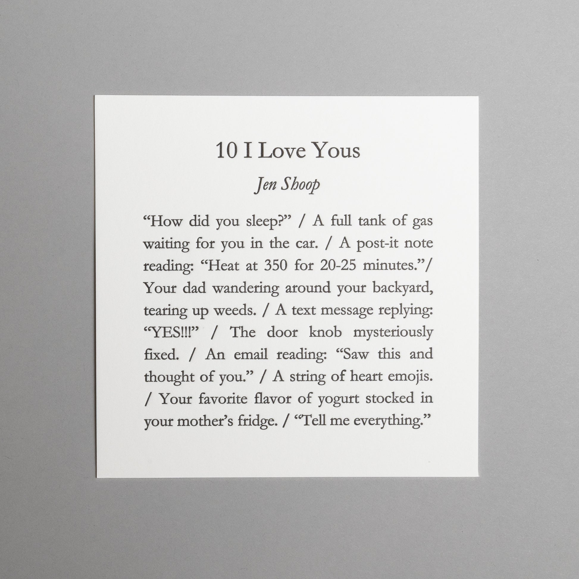 Front view of “10 I Love Yous,” a 5×5 black letterpress print by Jen Shoop on white paper.