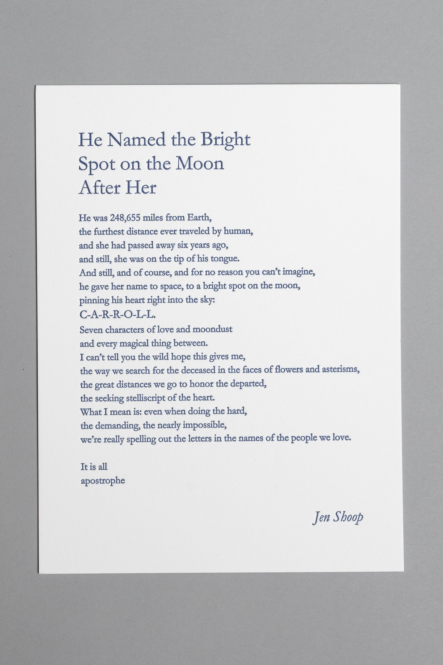 Front view of “He Named the Bright Spot on the Moon After Her,” a 6×8 blue letterpress print by Jen Shoop.