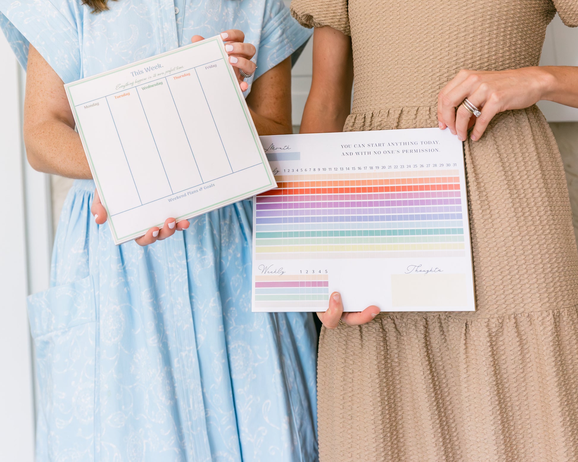 Magpie x Mamey habit tracker pad with rainbow color blocks, held by person in tan dress