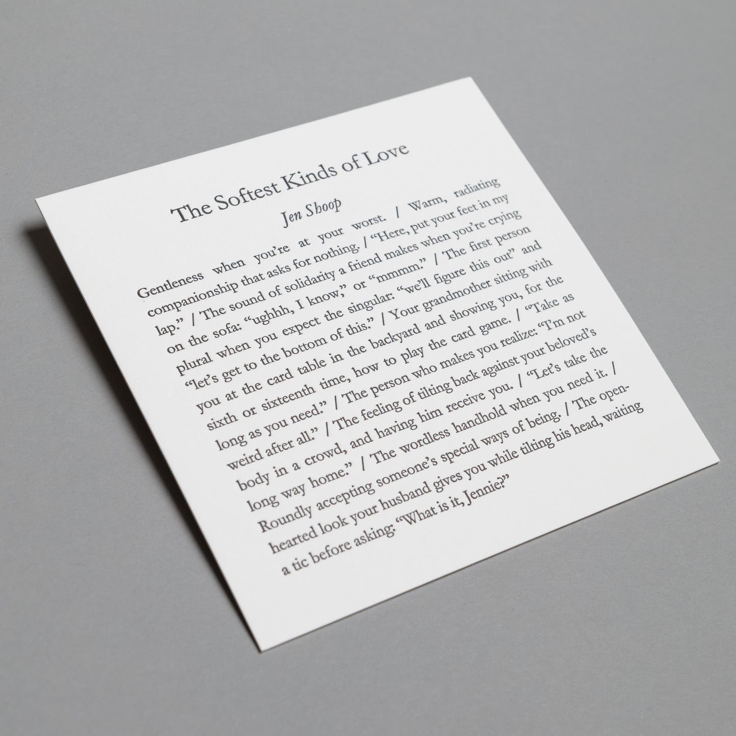 Angled view of “The Softest Kinds of Love” 5×5 letterpress print with impressed black type.