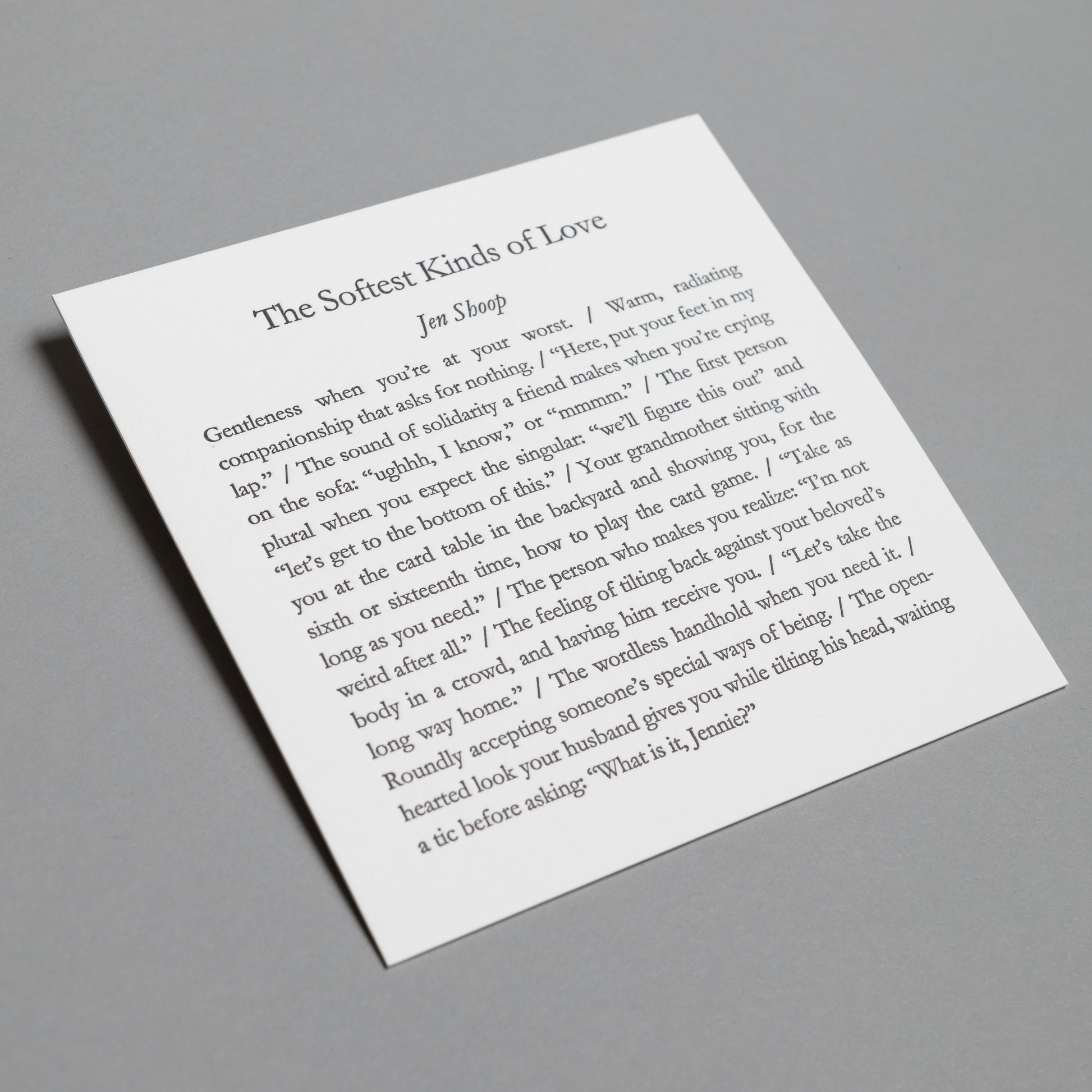 Angled view of “The Softest Kinds of Love” 5×5 letterpress print with impressed black type.
