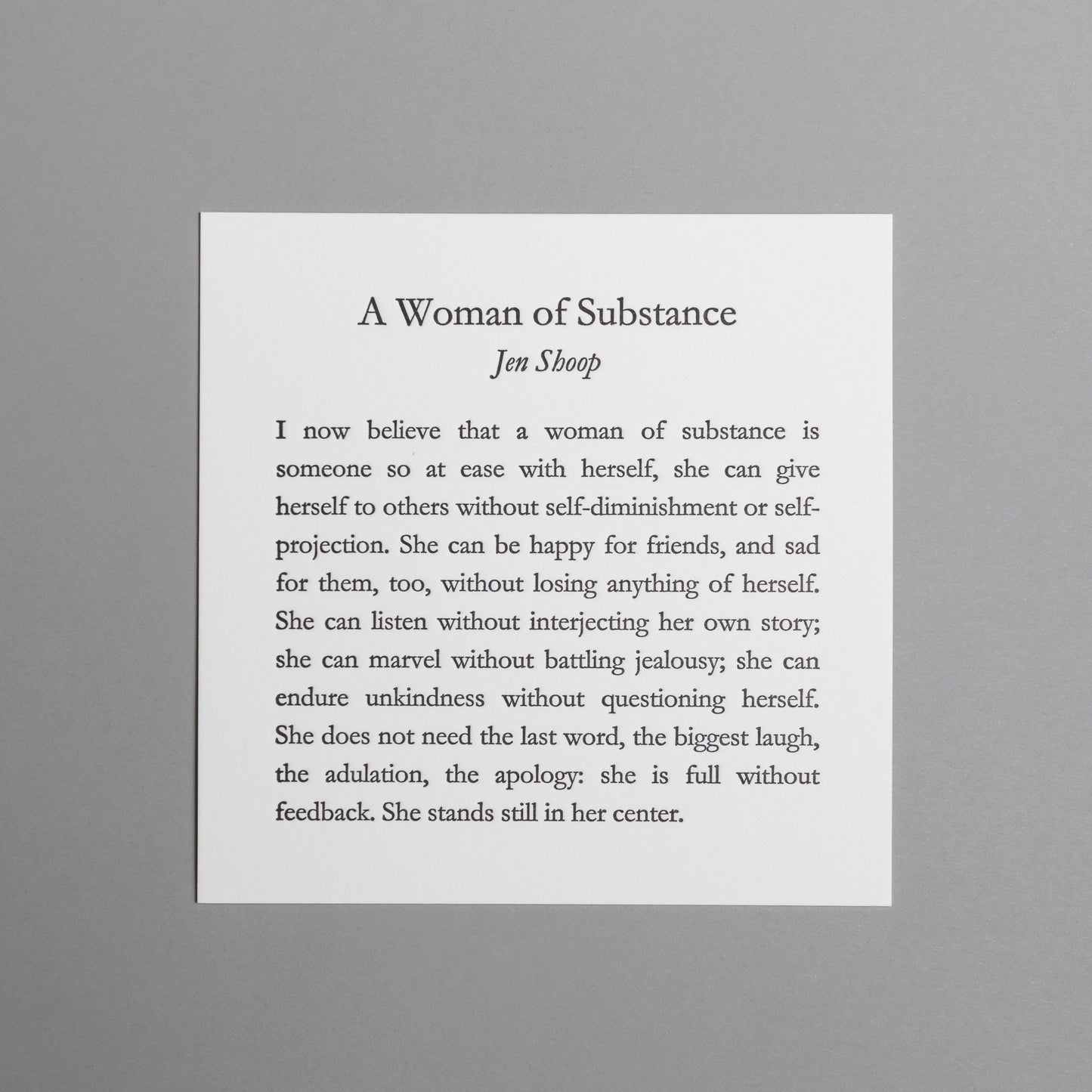 Front view of “A Woman of Substance,” a 5×5 black letterpress print by Jen Shoop on white paper.