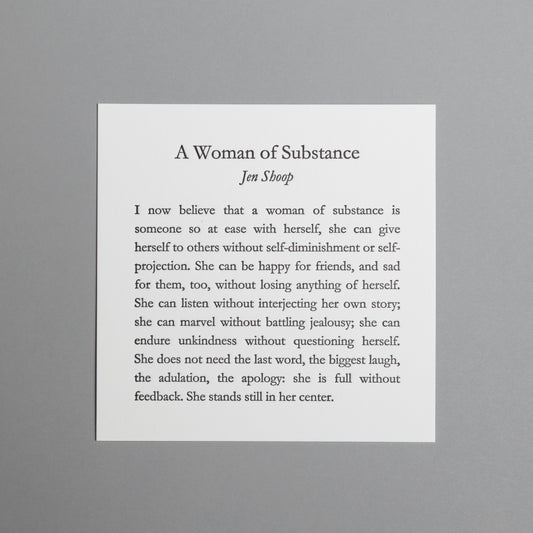 Front view of “A Woman of Substance,” a 5×5 black letterpress print by Jen Shoop on white paper.